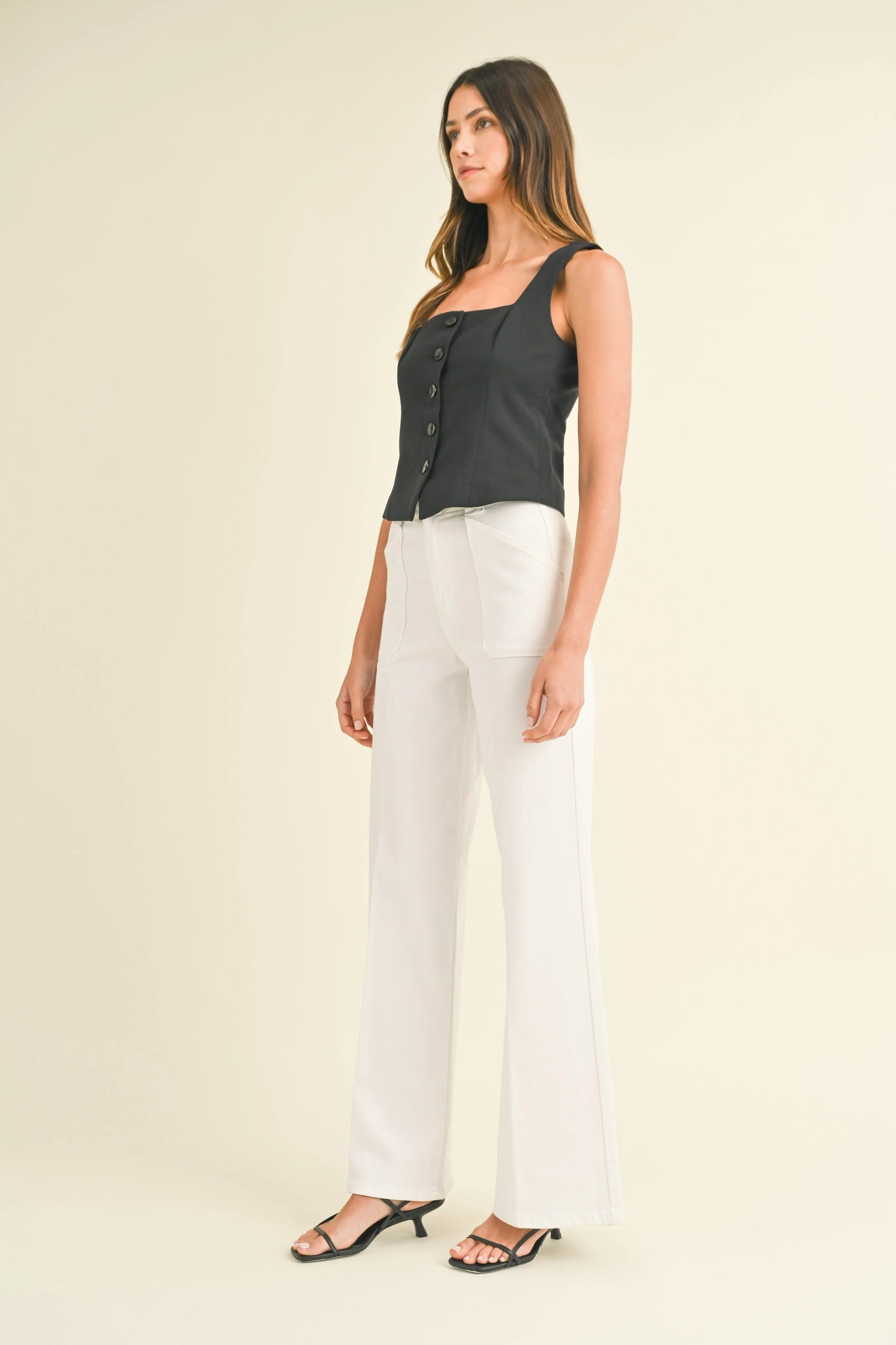 Woman modeling denim on a white background.