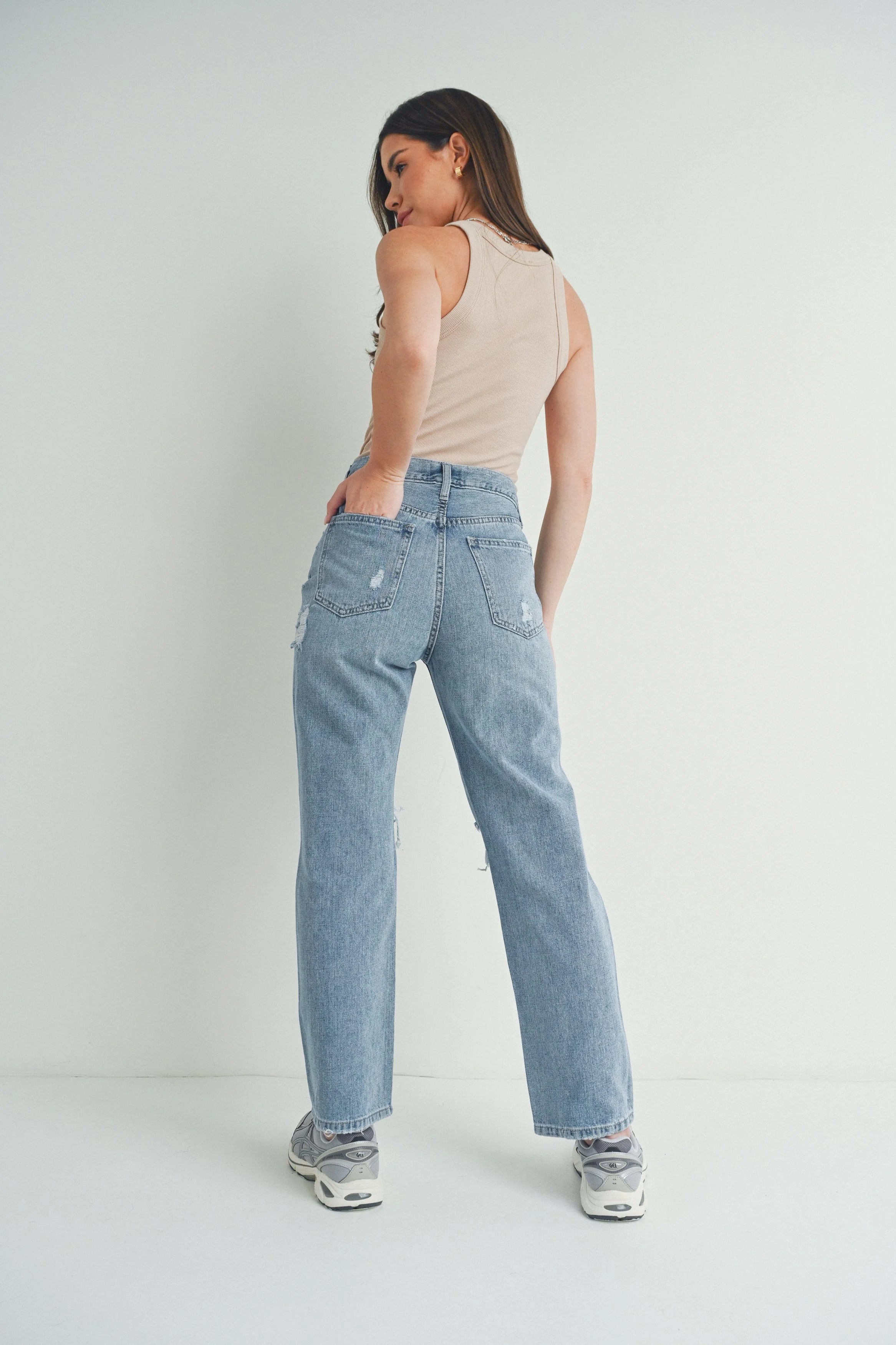 Woman modeling denim.