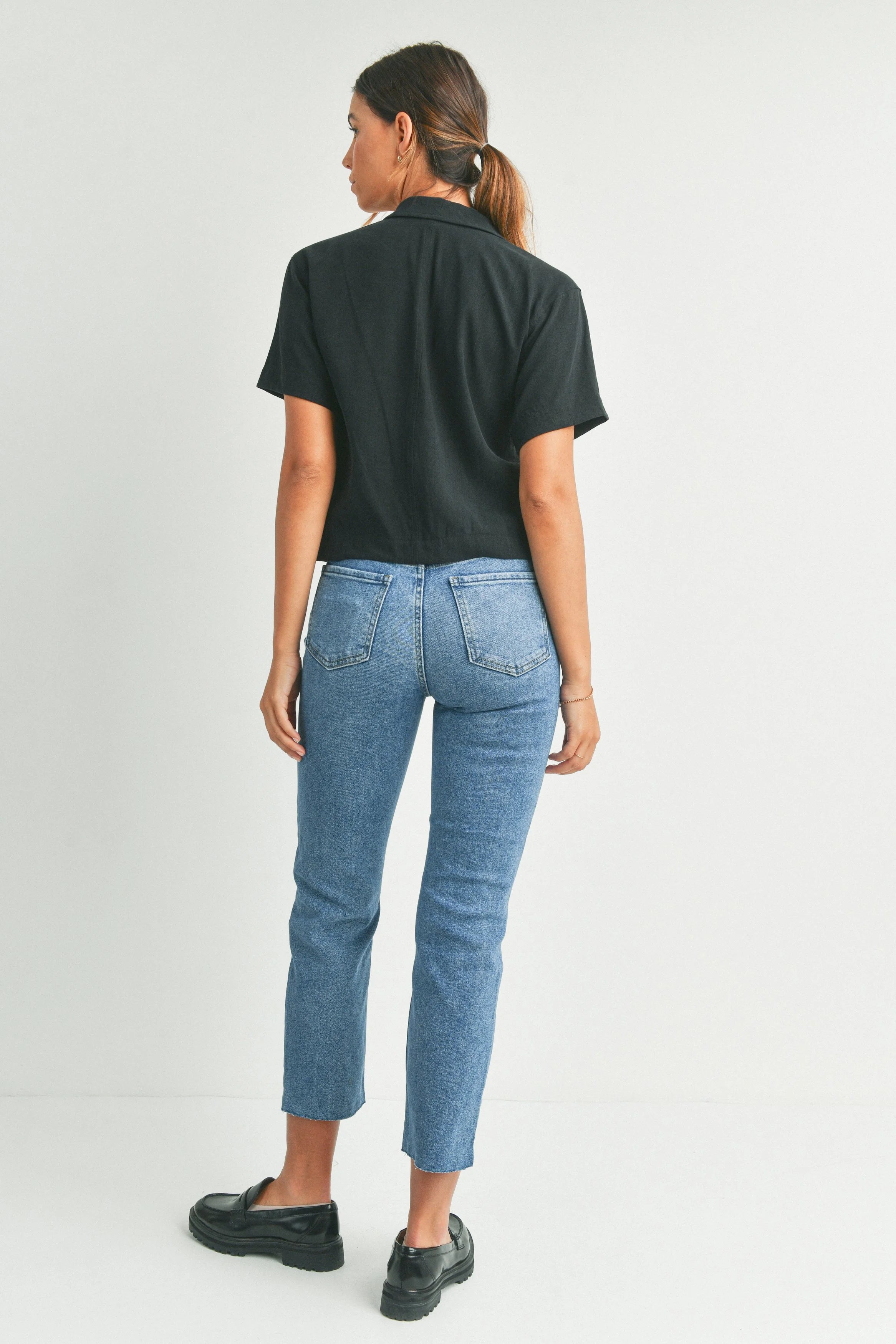 Woman modeling denim.